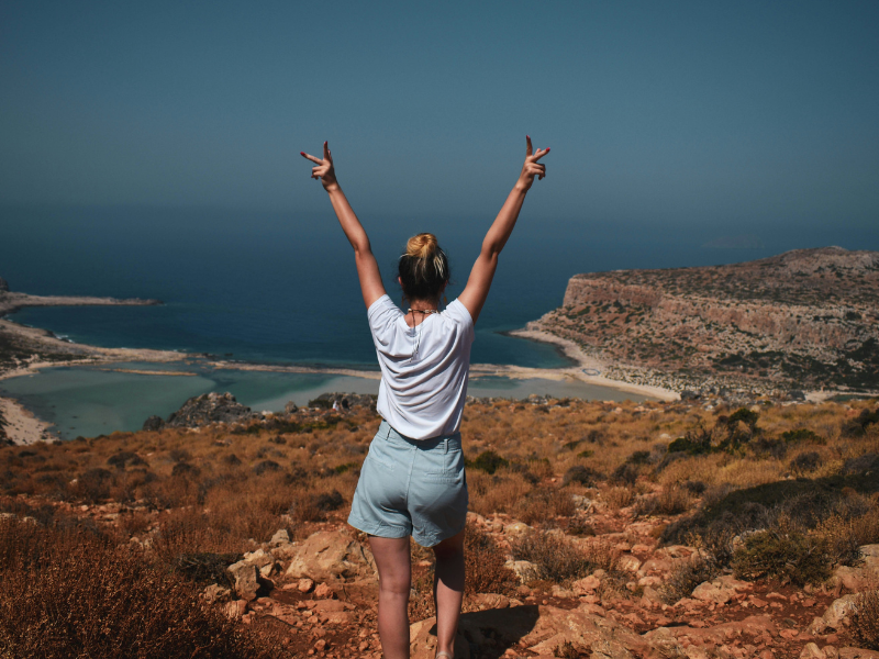 Woman traveler enjoying a scenic coastal landscape in Morocco
